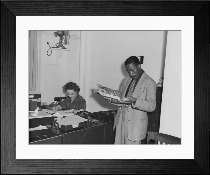 Framed Print : Gordon Parks (1912-1906) as a young photographer in the offices of the Farm Security Administration (FSA) after he won fellowship with to photograph for the FSA