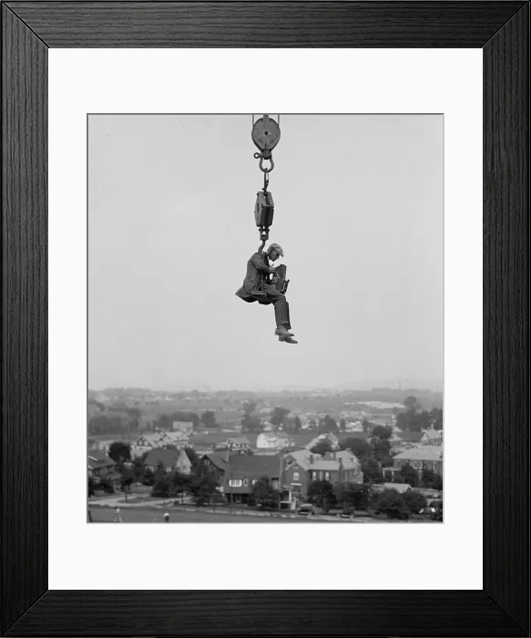 Framed Print : Washington, D.C. photographer hangs from a crane to capture a view of the city in 1923