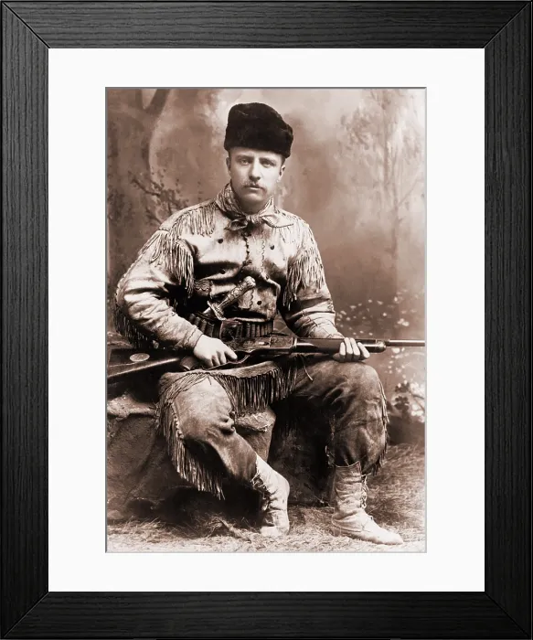 Framed Print : Young Theodore Roosevelt dressed in deer skins, posing with a rifle in an 1885 studio portrait Framed Print : Young Theodore Roosevelt dressed in deer skins, posing with a rifle in an 1885 studio portrait