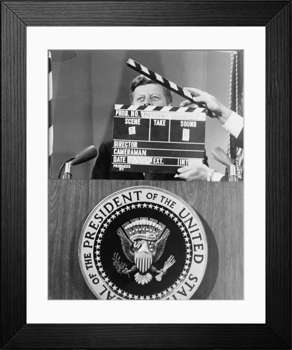 Framed Print : President John F. Kennedy's stands behind the presidential seal, during a television taping. July 3, 1963 Framed Print : President John F. Kennedy's stands behind the presidential seal, during a television taping. July 3, 1963
