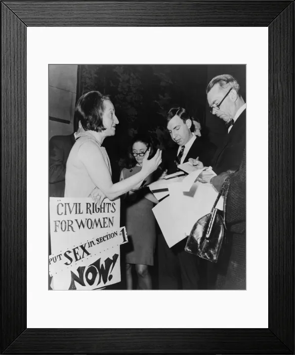 Framed Print : Betty Friedan, president of the National Organization for Women, talks to reporters in the lobby of New York State Assembly
