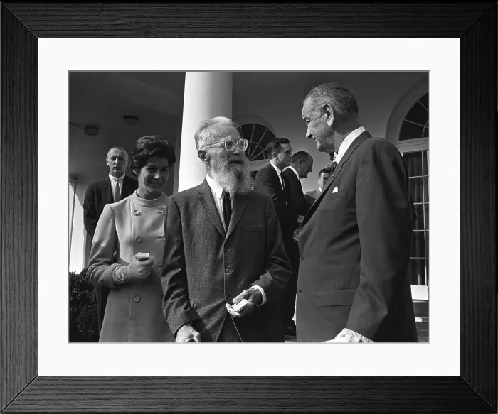 Framed Print : LBJ's Great Society programs. President Lyndon Johnson talks with master photographer Edward Steichen and his young wife after signing the Arts and Humanities Bill. Sept