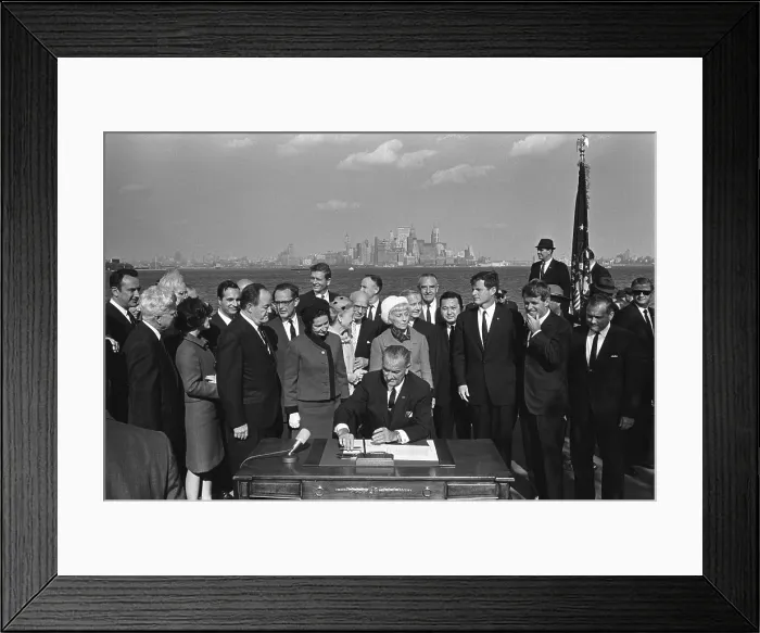 Framed Print : LBJ's Great Society programs. President Lyndon Johnson signing the Immigration Bill on Liberty Island in New York Harbor Framed Print : LBJ's Great Society programs. President Lyndon Johnson signing the Immigration Bill on Liberty Island in New York Harbor