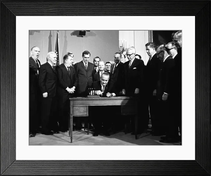 Framed Print : LBJ's Great Society programs. President Lyndon Johnson signing the Clean Air Act. Others present include Sec. Arthur Goldberg, Sen. Edmund Muskie, Sen