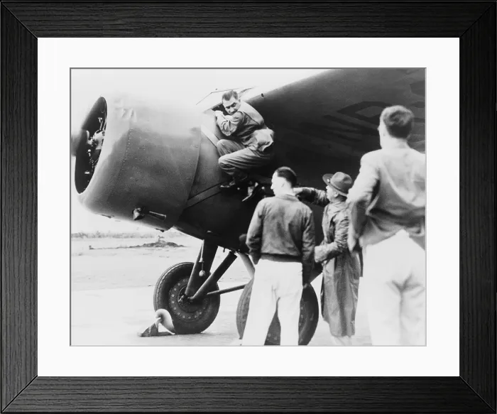 Framed Print : Paul Mantz, stunt pilot and air racer, served as Amelia Earhart's technician for her Hawaii to Oakland flight, climbing down after starting her plane at Wheeler Field Framed Print : Paul Mantz, stunt pilot and air racer, served as Amelia Earhart's technician for her Hawaii to Oakland flight, climbing down after starting her plane at Wheeler Field