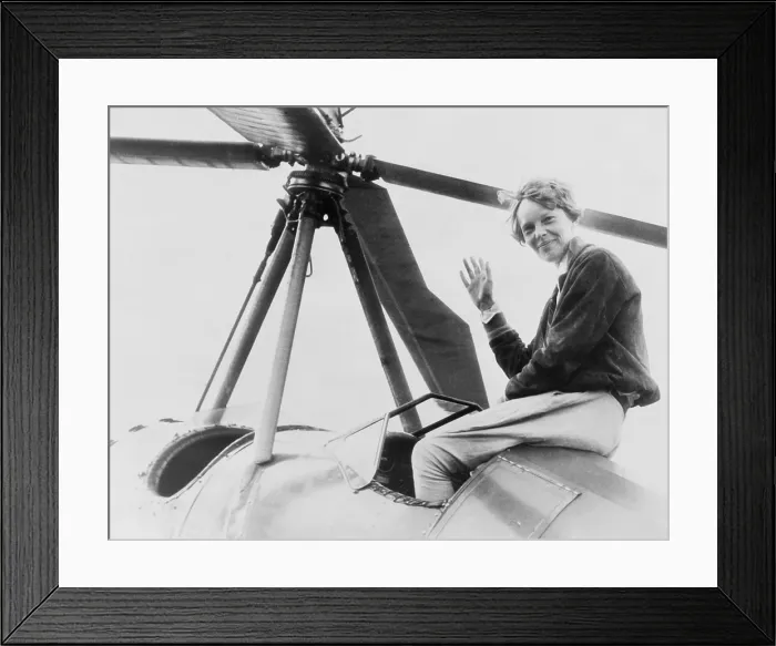 Framed Print : Amelia Earhart (1897-1937), waving, seated outside cockpit on top of an Autogiro, in Los Angeles
