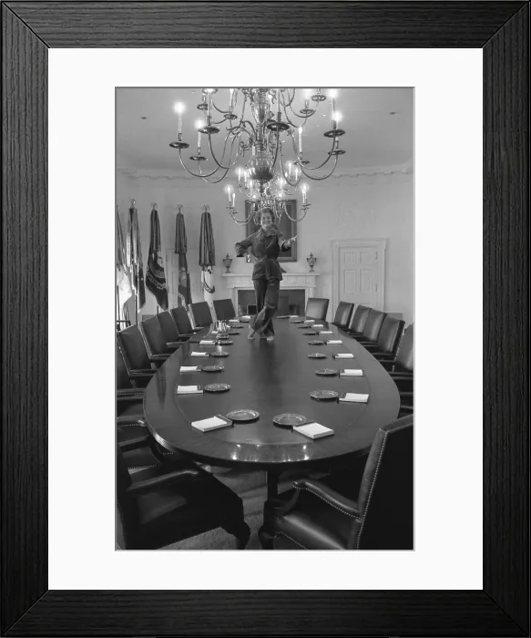 Framed Print : First Lady Betty Ford dances on the Cabinet Room table on the day before departing the White House upon the inauguration of President Jimmy Carter. January 19, 1977
