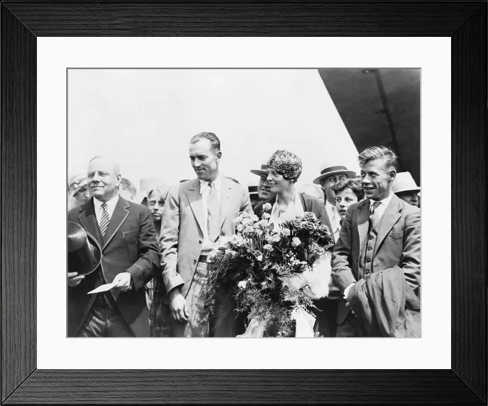 Framed Print : Mayor Malcolm Nichols, greets flyers Lou Gordon, Amelia Earhart, and Wilmer Stultz, as they arrived in Boston, Massachusetts, following trans-Atlantic flight in 1928