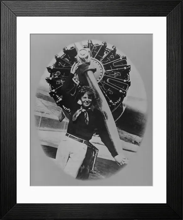 Framed Print : Amelia Earhart (1897-1937), posting in front of the propeller of her Lockheed L-10E Electra on July 8, 1937 Framed Print : Amelia Earhart (1897-1937), posting in front of the propeller of her Lockheed L-10E Electra on July 8, 1937