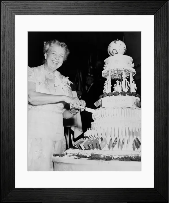 Framed Print : Eleanor Roosevelt celebrates her 70th birthday. Oct. 17, 1955. She cuts her cake at a dinner held by the American Association of the United Nations. Hotel Roosevelt, NYC