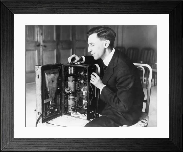 Framed Print : Inspector at the radio laboratory of the U.S. Bureau of Standards, Chicago, examines a portable radio built in a suitcase. 1920s Framed Print : Inspector at the radio laboratory of the U.S. Bureau of Standards, Chicago, examines a portable radio built in a suitcase. 1920s