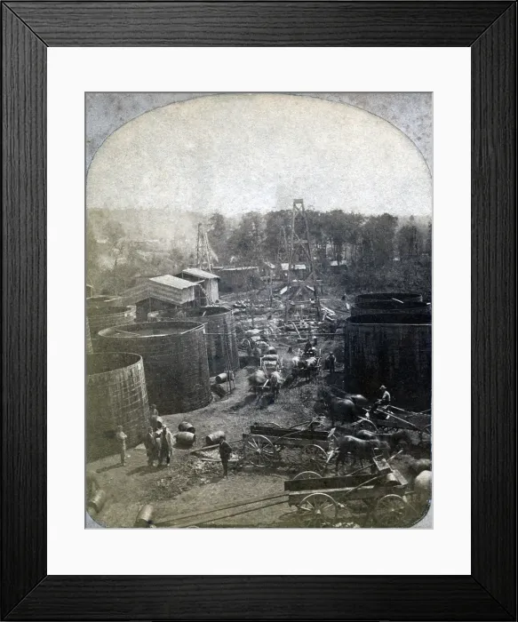 Framed Print : The Pennsylvania oil region. The United States Well at Pithole, Pennsylvania in 1865 showing large storage tanks, derricks, and horse-drawn wagons