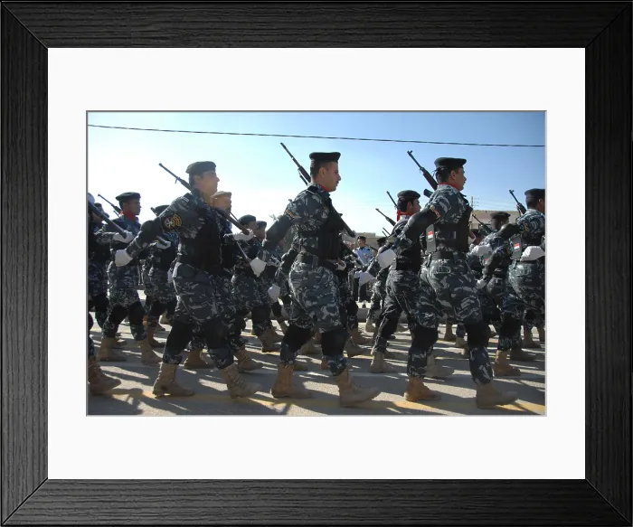 Framed Print : Iraqi police officers march during a parade in their honor near the in Nasiriyah Iraq. Jan. 9 2010. (BSLOC_2011_12_150)