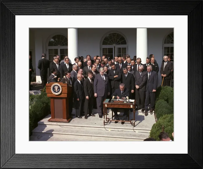 Framed Print : LBJ's War on Poverty. President Lyndon Johnson signing the Poverty Bill (aka Economic Opportunity Act). Aug. 20, 1964 Framed Print : LBJ's War on Poverty. President Lyndon Johnson signing the Poverty Bill (aka Economic Opportunity Act). Aug. 20, 1964