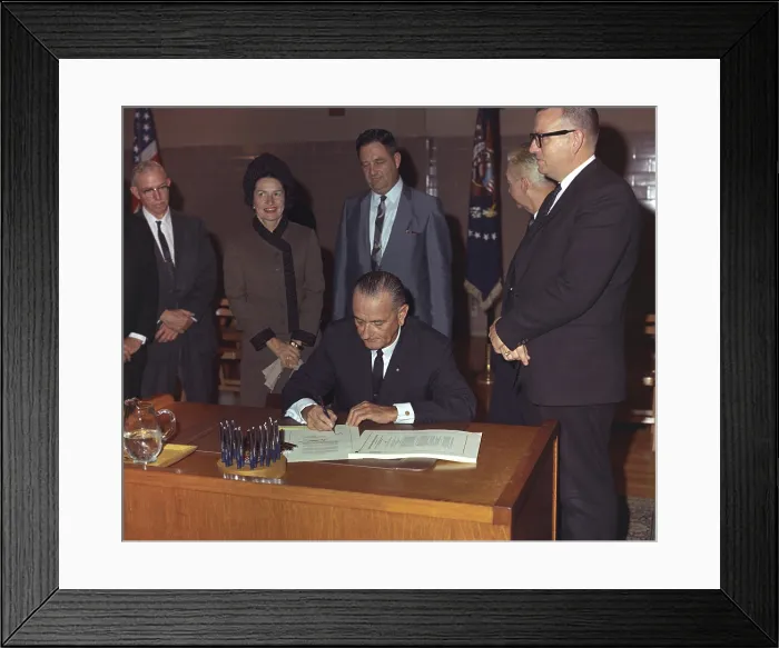 Framed Print : LBJ's Great Society programs. President Lyndon Johnson signing of the Higher Education Act of 1965 at Southwest Texas State College, where he attended college in the 1920s