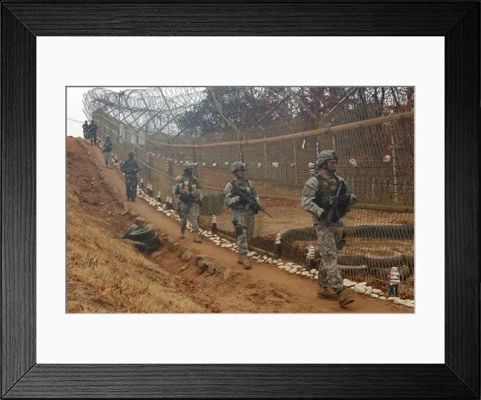 Framed Print : South Korean and US Soldiers patrol long a fence at the United Nations Security Area in Panmunjom during an annual training exercise. March 24 2007. (BSLOC_2011_12_193) Framed Print : South Korean and US Soldiers patrol long a fence at the United Nations Security Area in Panmunjom during an annual training exercise. March 24 2007. (BSLOC_2011_12_193)
