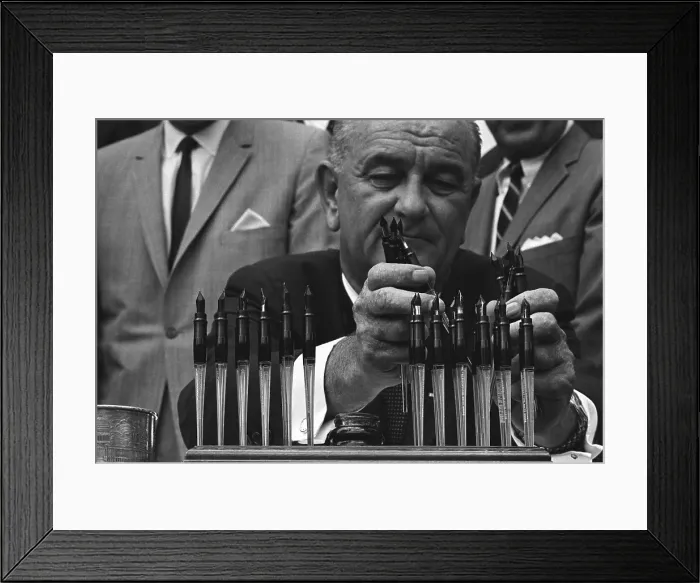 Framed Print : LBJ's Great Society programs. President Lyndon Johnson with the many pens he will use to sign the Housing and Urban Development Act of 1965 Framed Print : LBJ's Great Society programs. President Lyndon Johnson with the many pens he will use to sign the Housing and Urban Development Act of 1965