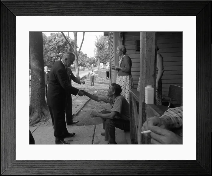 Framed Print : LBJ's War on Poverty. President Lyndon Johnson shakes hands with an Appalachian resident. May 7, 1964