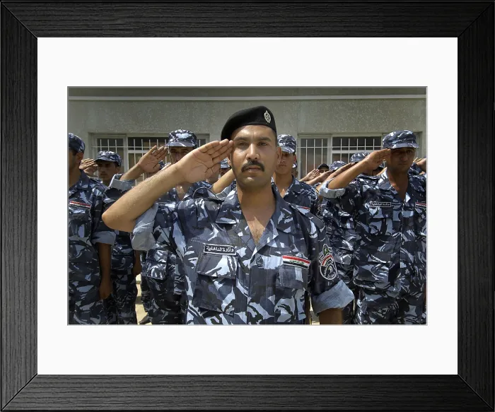 Framed Print : Graduates of the Iraqi Police Academy's salute during the commencement ceremony in Salman Pak Iraq. Aug. 29 2008. (BSLOC_2011_12_149)