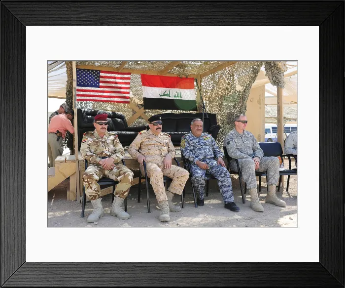 Framed Print : U.S. Army Brig. Gen. Robert Brown right of Multi-National Division watches an exhibition soccer game with Iraqi military leaders during Iraqi Security Forces training. Oct