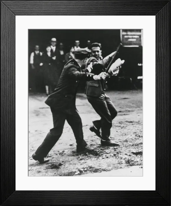 Framed Print : A striker dodges policeman's night stick during San Francisco General Strikes. 1934