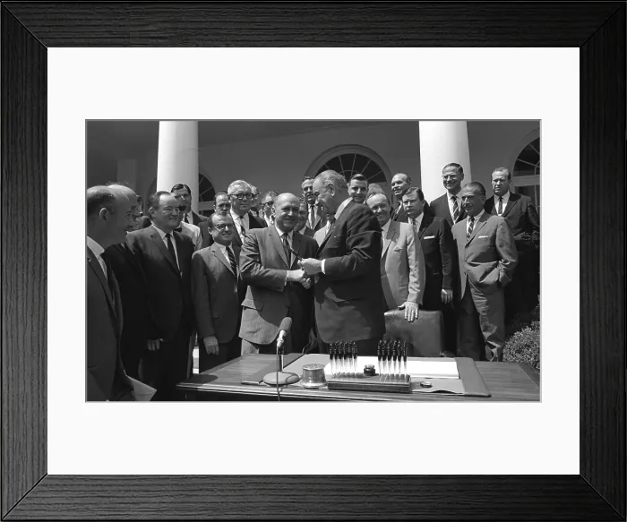 Framed Print : LBJ's Great Society programs. President Lyndon Johnson shakes HUD Secretary, Robert Weaver, after signing of the Housing and Urban Development Act