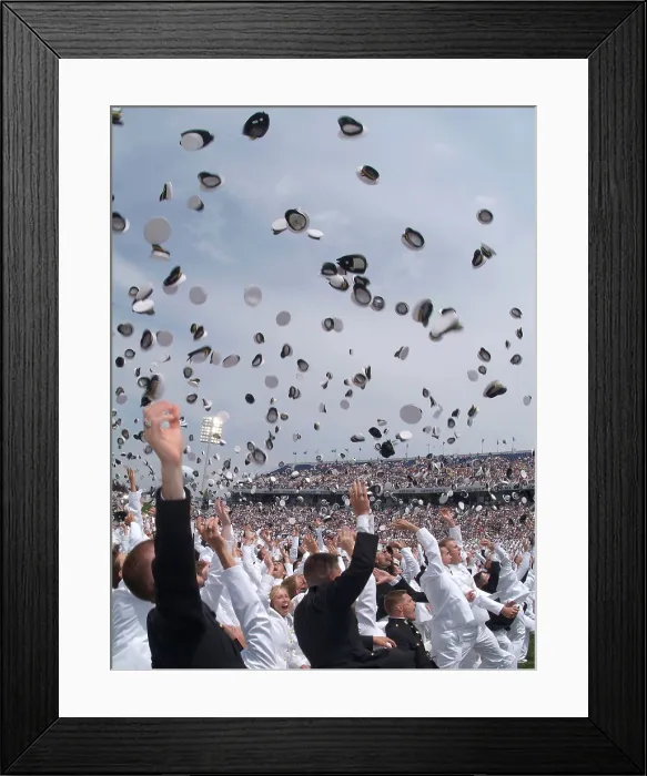 Framed Print : Newly commissioned officers toss their hats into the air at their 2006 graduation and commissioning ceremony. US Naval Academy in Annapolis Maryland. May 26 2006