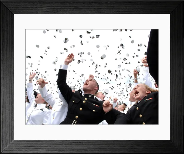 Framed Print : Newly commissioned Navy ensigns and Marine Corps 2nd Lieutenants toss their hats into the air at their 2006 graduation and commissioning ceremony