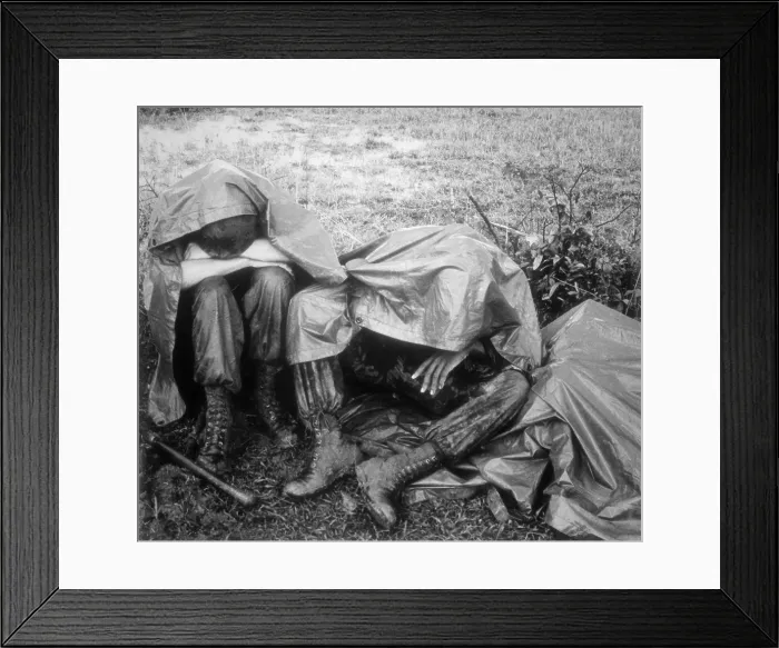 Framed Print : Vietnam War. Two battle weary US Marines take a break, rain and all, during Operation Bold Mariner Framed Print : Vietnam War. Two battle weary US Marines take a break, rain and all, during Operation Bold Mariner
