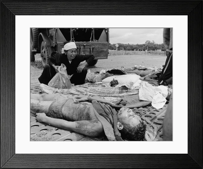 Framed Print : Vietnam War. South Vietnamese soldier's widow weeps over the body of her husband, one of the South Vietnamese Army casualties suffered in the war with the Viet Cong. 1965