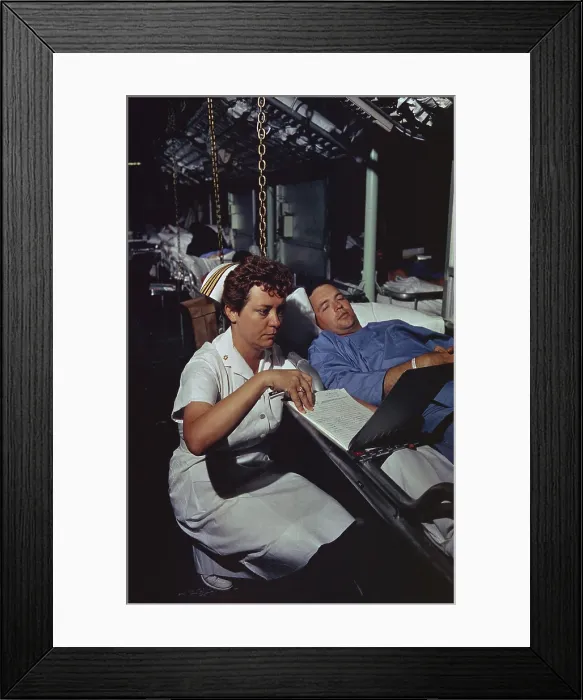 Framed Print : Vietnam War. Lieutenant Commander Dorothy Ryan, an Navy Nurse aboard the hospital ship USS Repose off South Vietnam, checks a wounded soldier's medical chart. April 4, 1966 Framed Print : Vietnam War. Lieutenant Commander Dorothy Ryan, an Navy Nurse aboard the hospital ship USS Repose off South Vietnam, checks a wounded soldier's medical chart. April 4, 1966