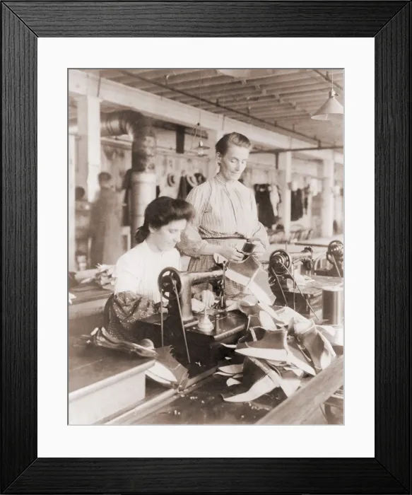 Framed Print : Woman operating a belt driven sewing machine at a shoe factory in Lynn, Massachusetts. 1895 photo by Frances Benjamin Johnston