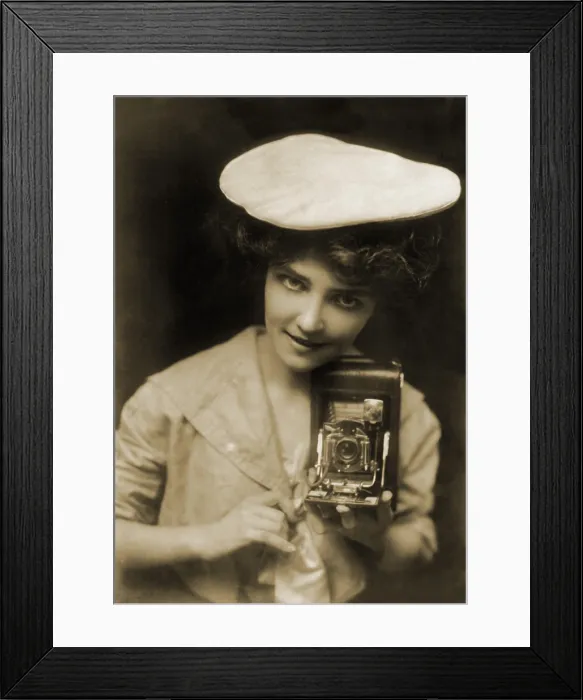 Framed Print : THE KODAK GIRL, a pretty girl posed with camera in a 1909 Kodak advertisement Framed Print : THE KODAK GIRL, a pretty girl posed with camera in a 1909 Kodak advertisement