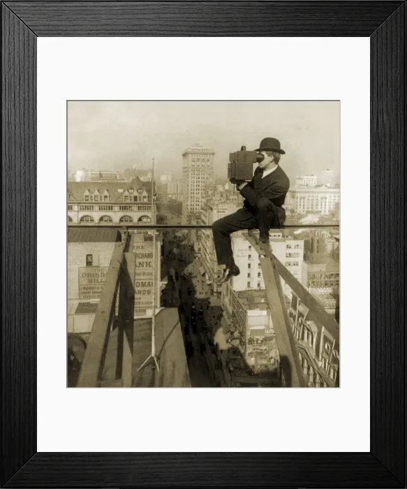 Framed Print : Photographer perched on slender beam 18 stories above pavement of Fifth Avenue, New York City. 1907 Framed Print : Photographer perched on slender beam 18 stories above pavement of Fifth Avenue, New York City. 1907