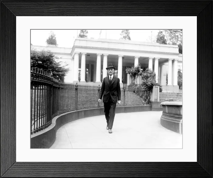 Framed Print : Andrew Mellon (1855-1937), industrialist and politician, then secretary of the Treasury, walking near the White House during the Harding Administration. 1921 Framed Print : Andrew Mellon (1855-1937), industrialist and politician, then secretary of the Treasury, walking near the White House during the Harding Administration. 1921
