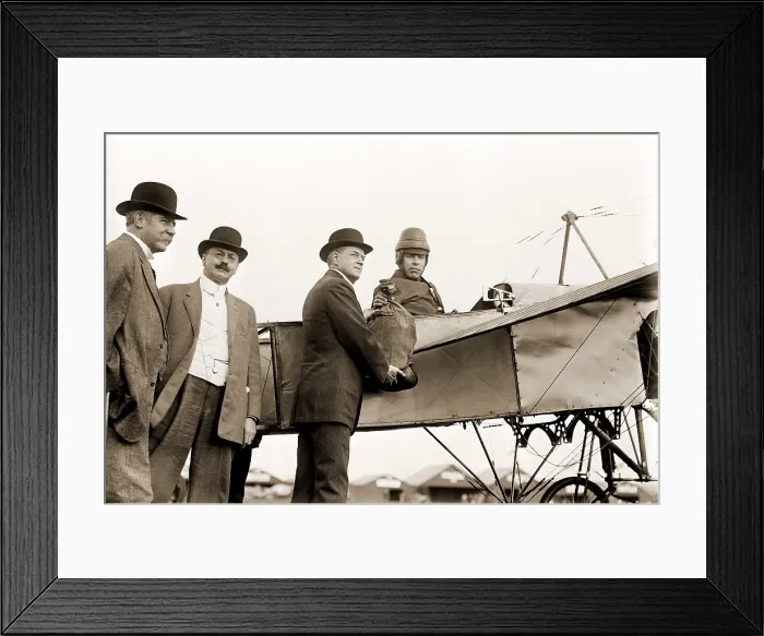 Framed Print : The first U.S. air mail pouch is handed to helmeted pilot Earle Ovington by Postmaster General Frank H. Hitchcock on Nassau Boulevard, Long Island, September 23, 1911 Framed Print : The first U.S. air mail pouch is handed to helmeted pilot Earle Ovington by Postmaster General Frank H. Hitchcock on Nassau Boulevard, Long Island, September 23, 1911