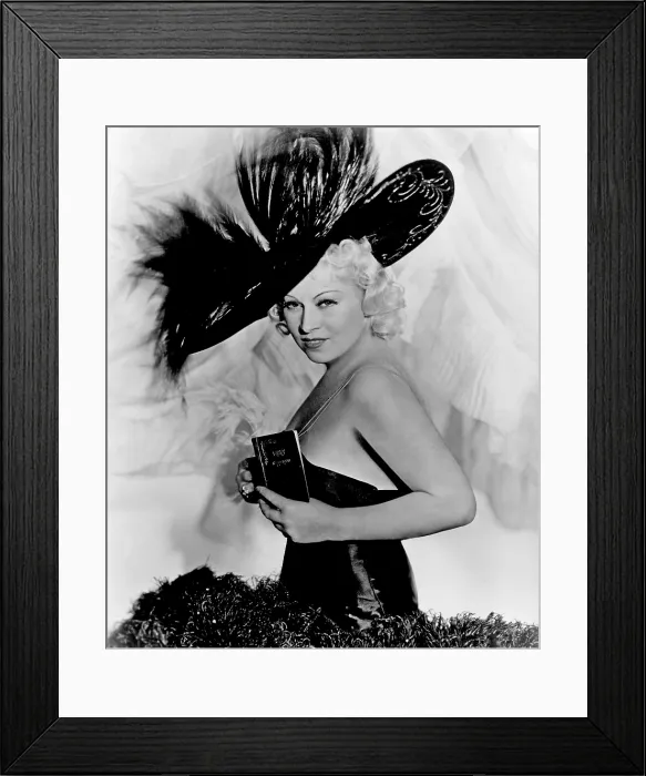 Framed Print : EVERY DAY'S A HOLIDAY, Mae West, in costume by Schiaparelli, 1937