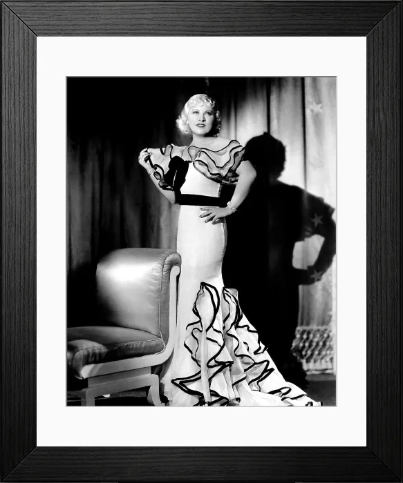 Framed Print : GOIN TO TOWN, Mae West (in a gown by Travis Banton), 1935