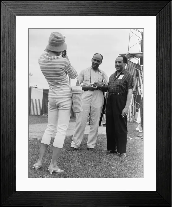 Framed Print : Ralph Ellison and Langston Hughes, famous African American authors, pose for an admirer's photo at the Newport Jazz Festival. Ca. 1959