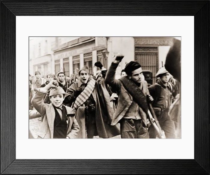 Framed Print : Battalion of Republican (anti-Franco) shock troops marching in Madrid during Spanish Civil War, Madrid. They make the clenched fist salute of solidarity. Ca. 1937