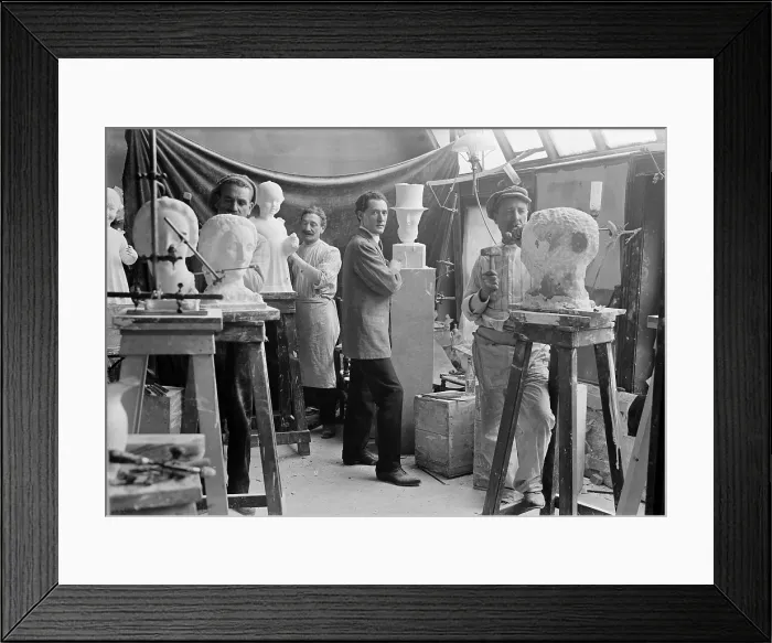 Framed Print : Elie Nadelman (1882-1946), Polish-born American sculptor standing beside his sculpture in an artists studio class. Ca. 1915