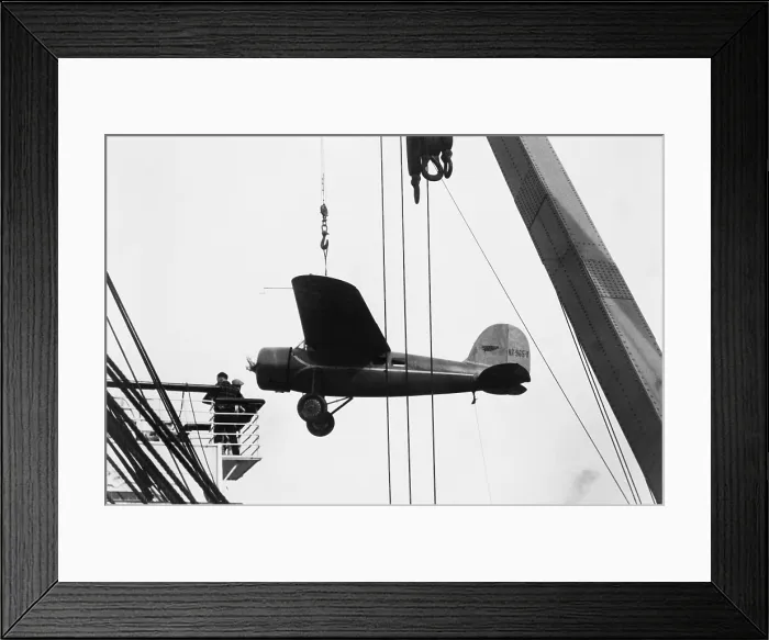 Framed Print : Amelia Earhart's Lockheed Vega airplane being off-loaded from the liner Lurline prior to her solo flight from Hawaii to California. January 1935 Framed Print : Amelia Earhart's Lockheed Vega airplane being off-loaded from the liner Lurline prior to her solo flight from Hawaii to California. January 1935