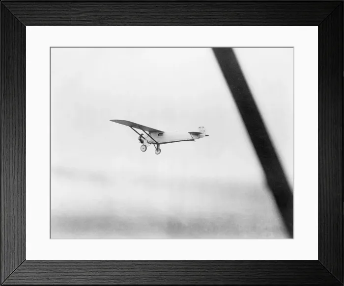 Framed Print : Charles Lindbergh's airplane, the Spirit of St. Louis, an hour into his historic first solo non-stop transatlantic flight. May 20, 1927 Framed Print : Charles Lindbergh's airplane, the Spirit of St. Louis, an hour into his historic first solo non-stop transatlantic flight. May 20, 1927