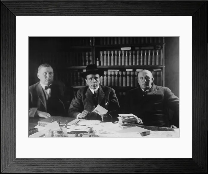 Framed Print : Harry Thaw (1871-1947), was allowed privileges during his during his incarcerations. Here he reads his mail while supervised by Sheriffs Holamn Drew and Kelser in New Hampshire