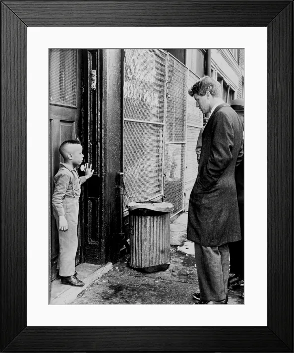 Framed Print : Senator Robert Kennedy (1925-1968), discusses school with one of his young constituents, Ricky Taggart of 733 Gates Avenue in Brooklyn, New York. February 4, 1966