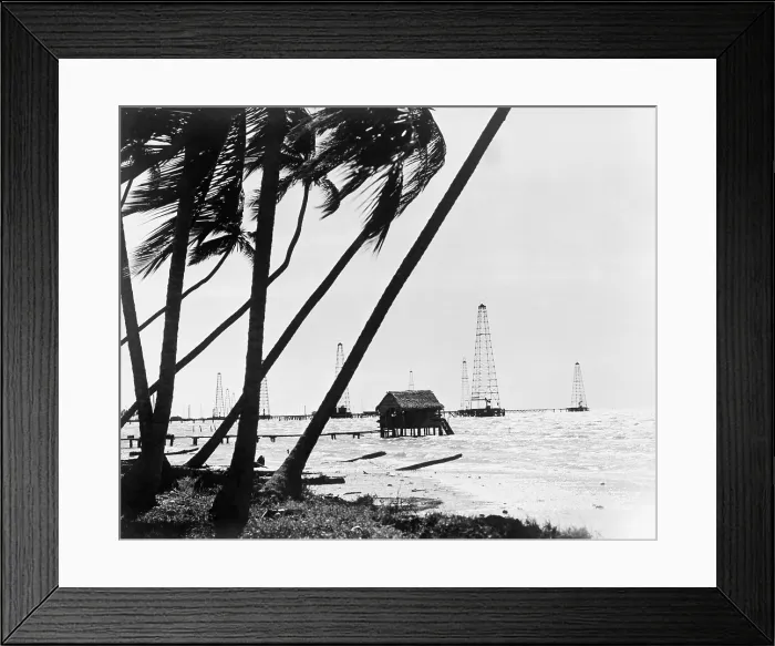 Framed Print : Oil derricks off the shore in Maracaibo Lake, Venezuela owned by Standard Oil Corporation of New Jersey. 1944