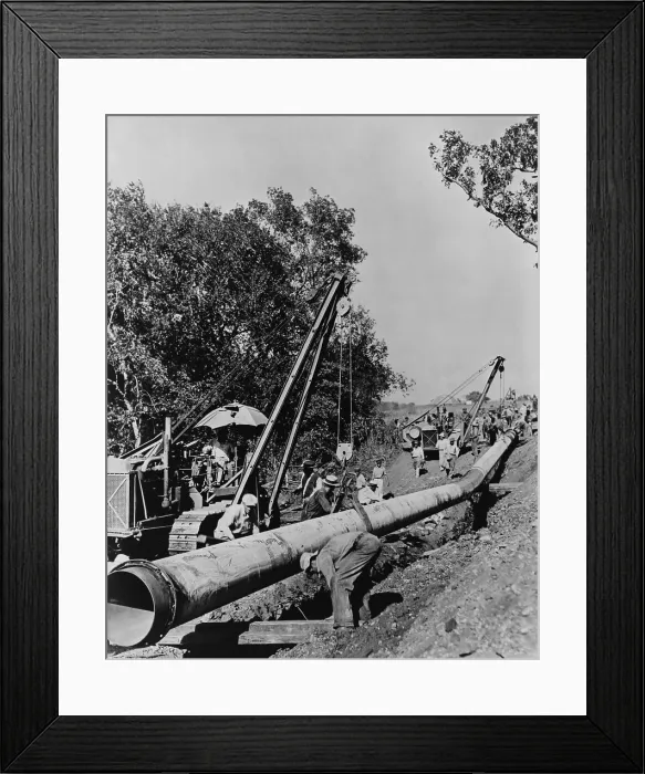 Framed Print : Laborers laying pipeline, to carry oil from Longview, Texas to Salem, Illinois in 1942