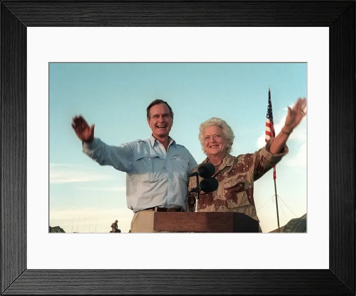 Framed Print : President George Bush and Barbara Bush wave to US troops based in Saudi Arabia preparing for the military operations to oust Iraq invaders from Kuwait. Thanksgiving Day Nov Framed Print : President George Bush and Barbara Bush wave to US troops based in Saudi Arabia preparing for the military operations to oust Iraq invaders from Kuwait. Thanksgiving Day Nov
