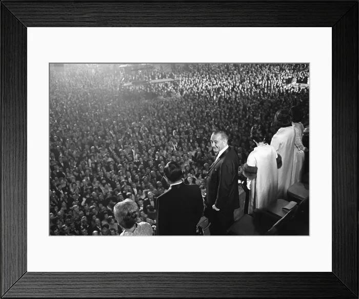 Framed Print : The 1965 Inaugural Ball. L-R: Muriel Humphrey, VP Hubert Humphrey, President Johnson, Lady Bird Johnson, Lynda Johnson, and Luci Johnson stand above a crowd on Inauguration night