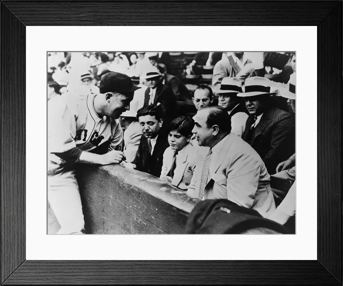 Framed Print : Chicago Cubs player Gabby Hartnett autographing a baseball for Sonny Capone who is sitting with his father Al Capone and other gangsters at a 1931 charity baseball game Framed Print : Chicago Cubs player Gabby Hartnett autographing a baseball for Sonny Capone who is sitting with his father Al Capone and other gangsters at a 1931 charity baseball game